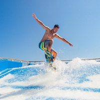 flowrider-surf-simulator-instructor-man-day-activity